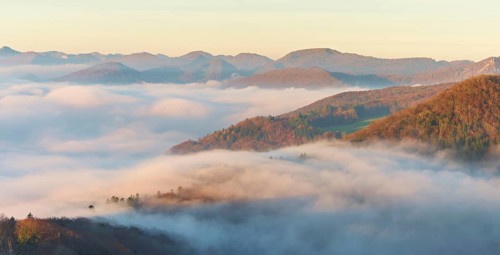 View from the Gisliflue of the Jura foothills covered in fog in morning light, Talheim, Canton,