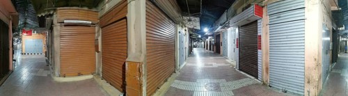 Medina, during Ramadan, darkened market alleys with closed shutters in an urban night atmosphere,
