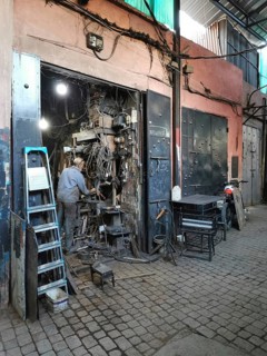 A well-stocked workshop full of cables and tools in a medina, Morocco