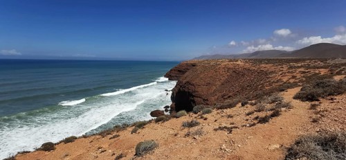 Rugged coastal land with views of the vast ocean and cliffs, Morocco