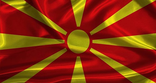 North Macedonia flag with cloth textured background. National flag of North Macedonia with