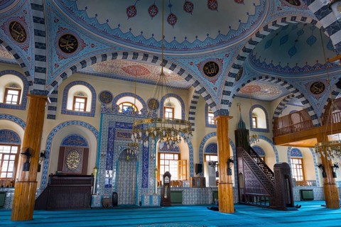 Bright mosque interior with ornate blue ornaments and majestic dome, Kapu Mosque, Ottoman era