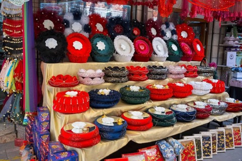 Welcoming shop with a colorful selection of handmade henna sets, henna tray and basket set, covered