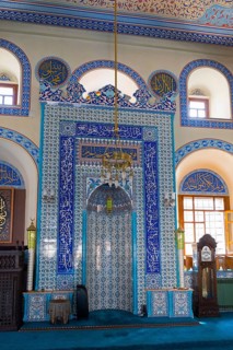 Detailed view of a richly decorated prayer niche in light blue tiles, Kapu Mosque, mosque from the