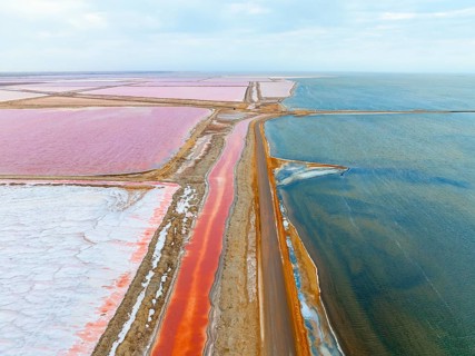 Aerial view of colorful dry pools with salt, saline near Walvis Bay, Namibia