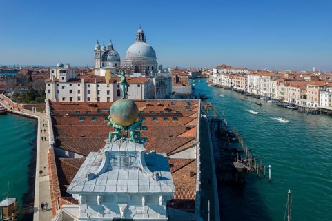 Drone footage of the Dogana da Mar, moving wind vane of Saint Fortuna on a gilded globe carried by