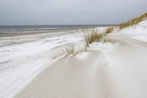 Snow-covered dunes on the North Sea beach, Langeoog, Lower Saxony, Germany