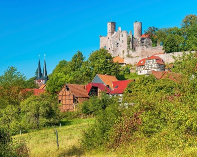 View of the ruins of Hanstein Castle and the small village of Rimbach, half-timbered houses and