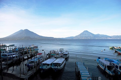 Boats on the pier, Lake Atitlán or Lake Atitlán in the morning, the volcanoes San Pedro, Atitlán