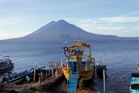 Boats on the dock, Lake Atitlán or Lake Atitlán in the morning, the volcanoes Atitlán and Toliman