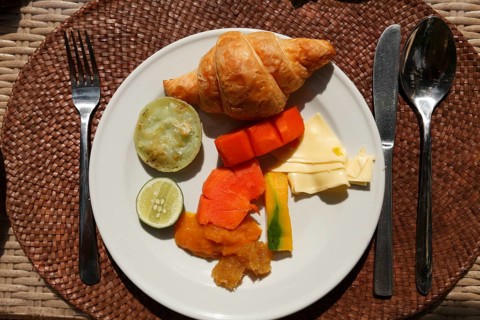 Rich breakfast at the hotel with fruits and vegetables, Ubud, Bali, Indonesia
