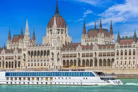 Hungary, boat cruise on Danube River near Budapest Parliament. Panoramic view of city skyline of