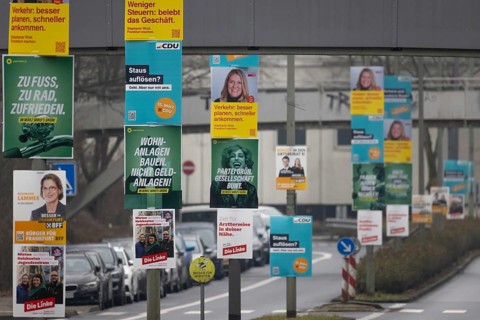Numerous election posters for the 2026 local elections are hanging one behind the other on several