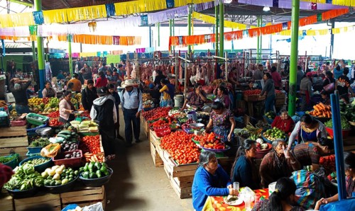 Mayan woman wearing traditional clothes at the market in Sololá, Highlands, Sololá Department,