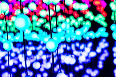 Light, glowing balls, LED lamps, hang in series, side by side, on top of each other, change their