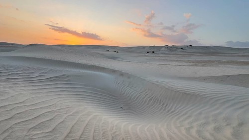 Sunset, white sand dunes in the Khaluf desert, Oman