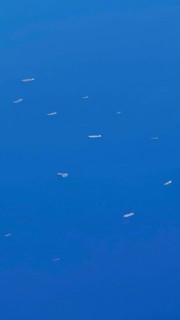 Aerial view of ships in the blue ocean and a wide horizon, Albania