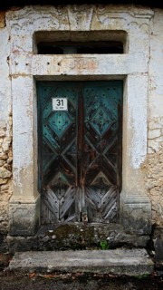 Weathered wooden garden door with an old, mysterious charm, rural style