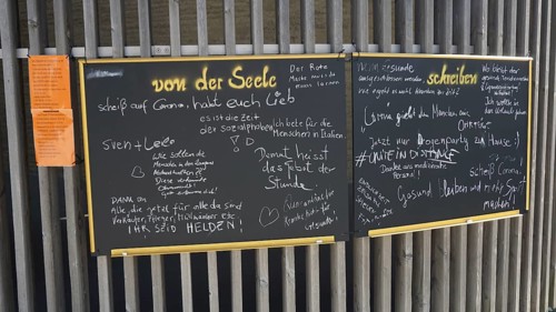 Blackboard written in chalk with various messages and notes during Corona, Berlin