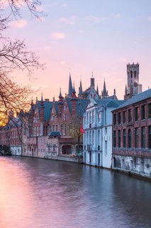 Bruges. Belgium. Flanders. Houses in the historic district overlooking a canal. UNESCO