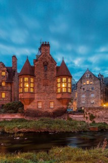 Dean Village, Edinburgh, Scotland, UK. Traditional houses and church with canal in historic Dean