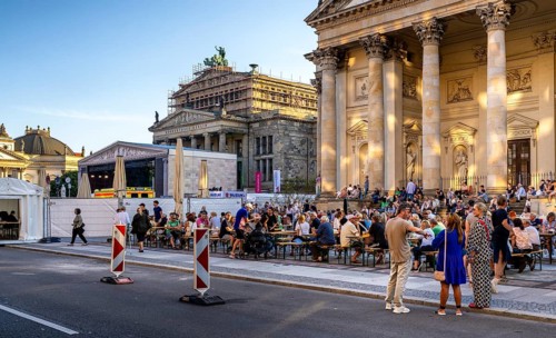 Listeners and spectators at a concert at Berlin's Gendarmenmarkt, Germany