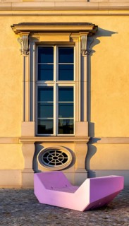 Pink and red plastic furniture for sitting and lying in front of the Humboldt Forum, Berlin,