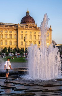 Water fountain, summer lifestyle, tourists and passers-by in the pleasure garden in Berlin-Mitte,