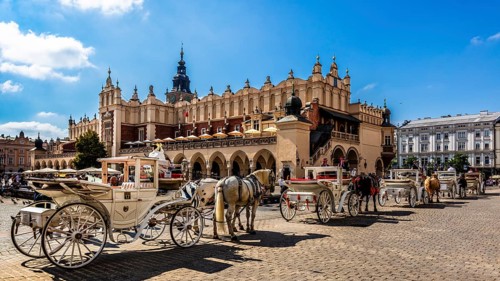 Carriage in front of Rynek with Cloth Hall, from 13th century, Main Market Square, landmark of the