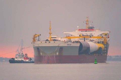 A semi-submersible ship is towed from the Weser to the North Sea, Bremerhaven, Bremen, Germany