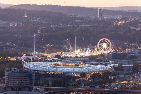29 Sep 2018 at dusk, Volksfest lights seen from Rotenberg chapel with stadium foreground and