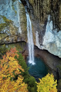 Aerial view of Berglistüber waterfall in autumn-colored surroundings, Linthal, Klausenpass, Canton