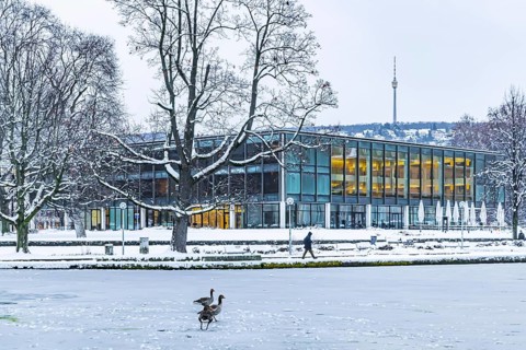 Exterior view of the state parliament building with Eckensee and television tower. Winter in