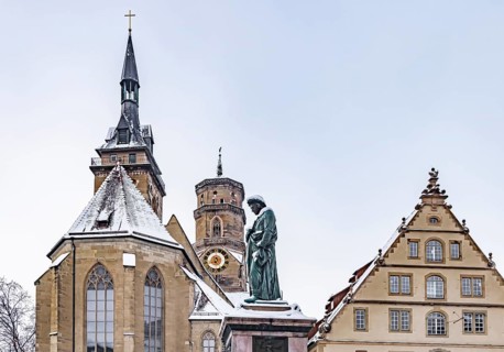 Winter in Stuttgart. The city is wintry white early in the morning. Schillerplatz with collegiate