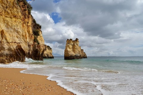 Rocky coast and beach, Praia do Pinhao, Lagos, Algarve, Portugal