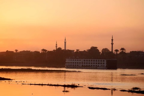 Nile cruise ship at sunset on the Nile, Luxor, Egypt