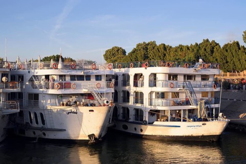 Nile cruise ships at the pier at the double temple of Kom Ombo, Kom Ombo, Egypt