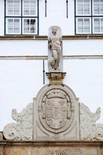 Torhaus am palace gardens, façade with figure and coat of arms, Husum, North Frisia,