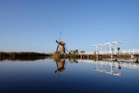 Historic windmill and drawbridge, UNESCO World Heritage Site, Kinderdijk, South Holland,