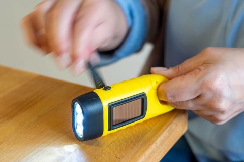 Crank operated flashlight, by turning the crank, we generate electricity in a dynamo, which charges