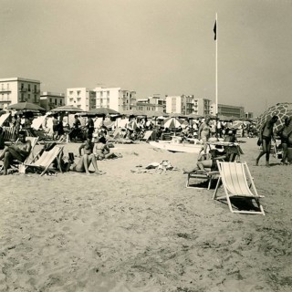Historical photo summer 1961, tourists, beach, Rimini, Italy