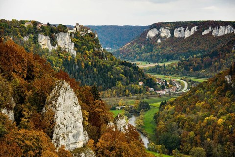 Autumnal forest and Werenwag Castle, Eichfelsen viewpoint, near Irndorf, Upper Danube nature park