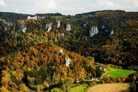 Autumnal forest and Wildenstein Castle, Rauher Stein viewpoint, near Leibertingen, Upper Danube