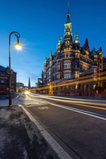 Speicherstadtrathaus in Speicherstadt with road traffic at the blue hour, Hamburg, Germany
