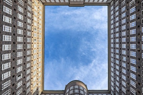 View of the sky in the courtyard of the Chilehaus in the Kontorhausviertel, Hamburg, Germany