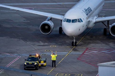 Apron supervision, Lufthansa Airbus is instructed to the parking position at the gate, at
