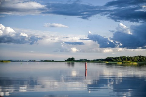 Fairway to Ekenäs harbour with sea mark on Lake Vänern, water reflecting the sky, Ekenäs,