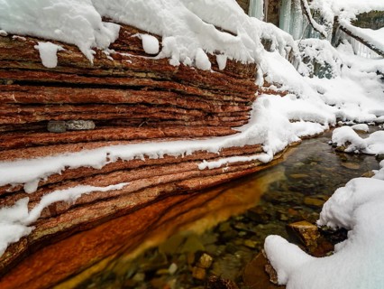 Taugl or Tauglbach flows through the snow-covered and icy red gorge, also Marmorklamm, Bad Vigaun,