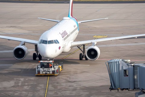 Eurowings Airbus is pushed from the gate onto the taxiway, ready to go, to Cologne/Bonn Airport,