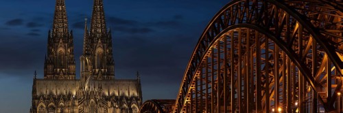 Evening atmosphere, Cologne Cathedral illuminated with LED lamps and the Hohenzollern Bridge,
